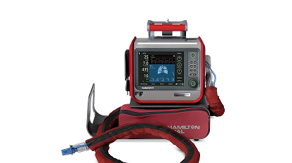 Red Hamilton ventilator machine with digital display and attached breathing tube on white background.