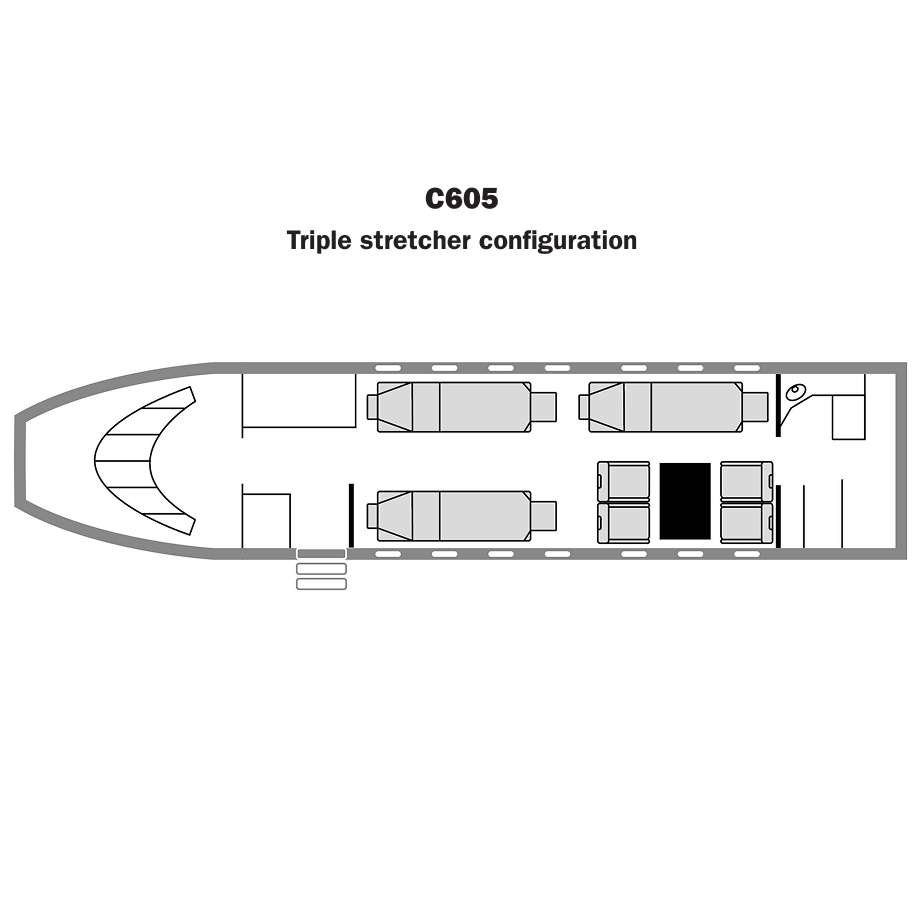Top-down floor plan of Challenger 605 interior showing two rows of single seats facing forward, four seats around a central table, a restroom, and a curved front cockpit.