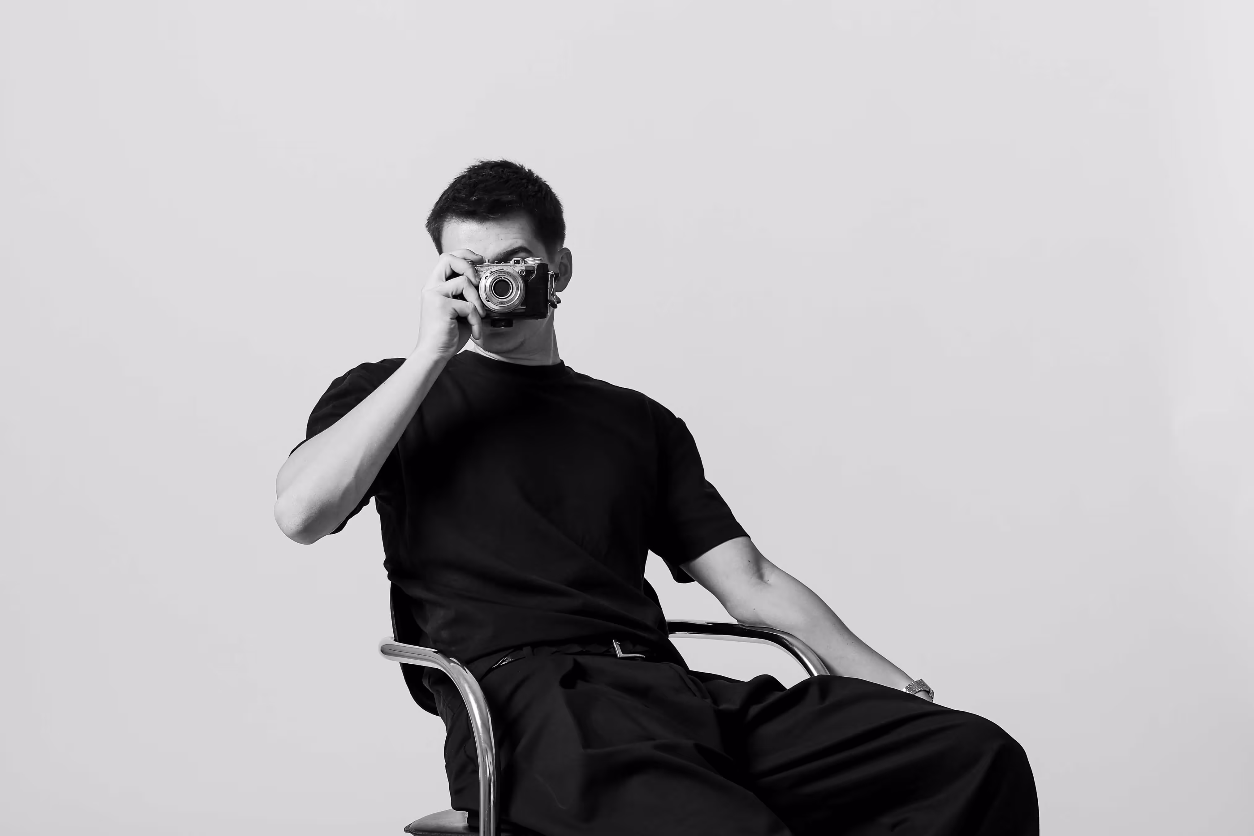Blurred person wearing a red jersey with the number 8, with red and white seats in the foreground.