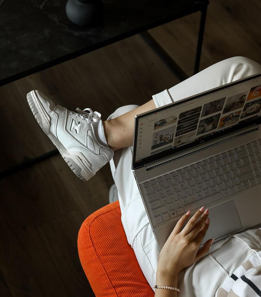 Two people holding up a colorful banner with large letters 'W 7' and text 'Williamstown Theatre Festival' in the center.