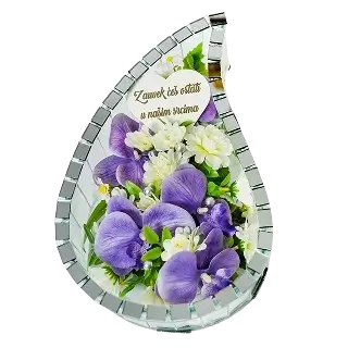 Floral arrangement with purple and white flowers and a heart-shaped plaque with text in Polish.