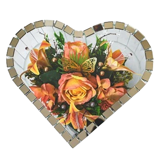 Heart-shaped mirror frame with a bouquet of orange and yellow flowers and a decorative butterfly inside.
