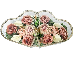 Decorative mosaic of pink roses, cream lilies, and green leaves with a scalloped border.