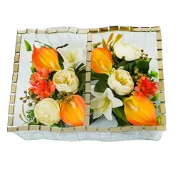 Two rectangular mosaic trays decorated with white, orange, and red artificial flowers and green leaves.