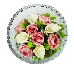 Round mirrored vase filled with pink roses, white calla lilies, and small green flowers.