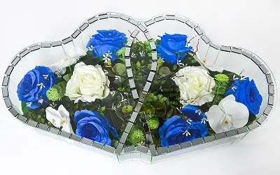 Heart-shaped stained glass piece featuring pink and peach flowers with green leaves.