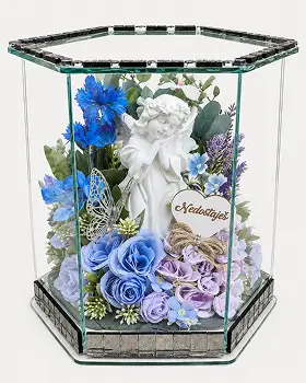 Glass box with golden frame containing a bouquet of red roses, white lilies, and small white flowers with green leaves.
