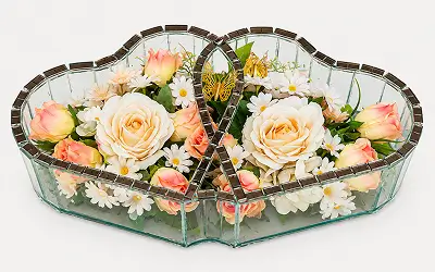 Decorative glass piece featuring red roses and white orchids with green leaves inside.