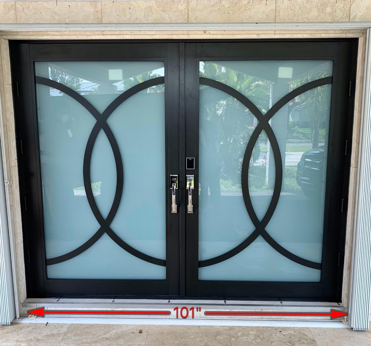 Double black framed french door with decorative circular patterns and a red measurement line indicating 101 inches width at the bottom.