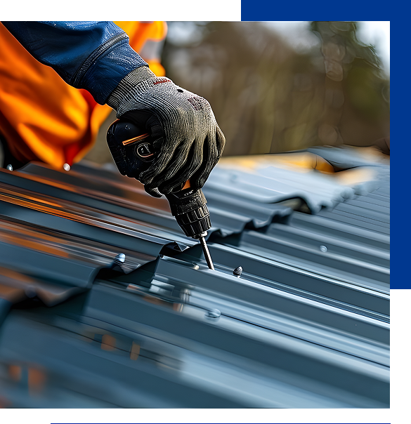 Person wearing gloves using a cordless drill to fasten screws on a metal roof.