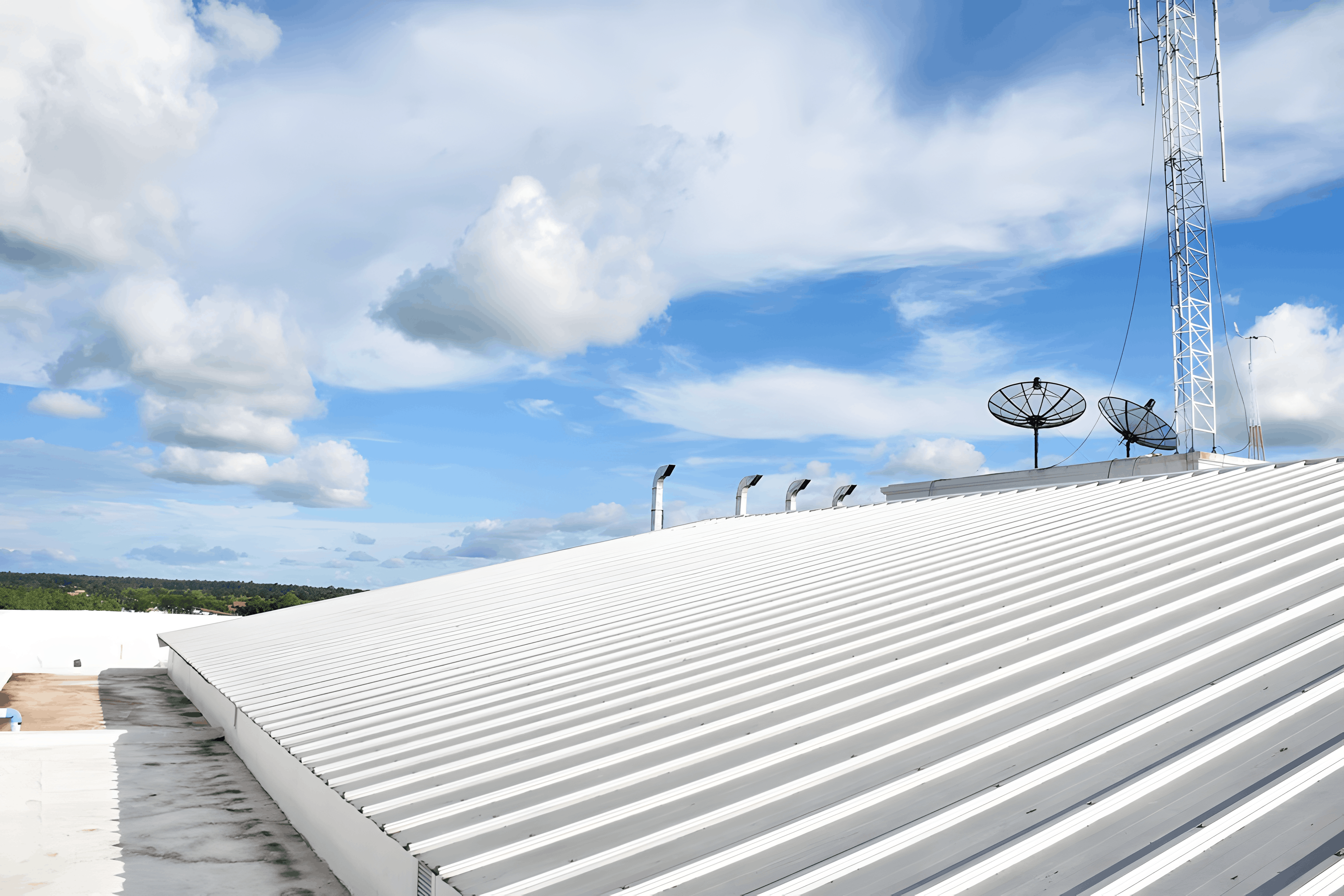 A white commercial roofing metal roof installation