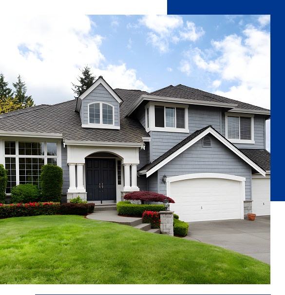 Two-story gray house with white trim, black front doors, large windows, a double garage, and a manicured green lawn.