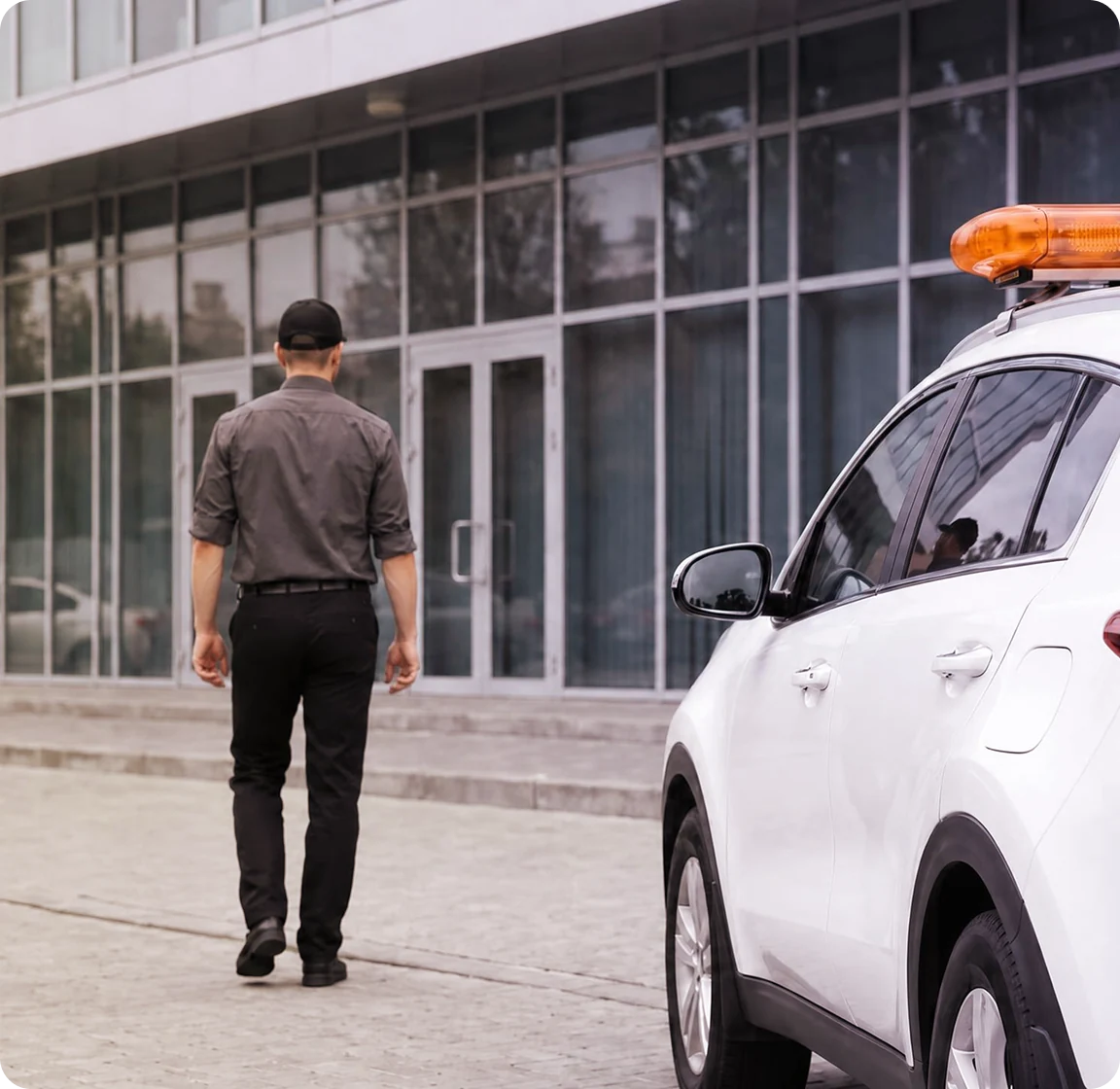 Security officer arriving on site at a commercial property.