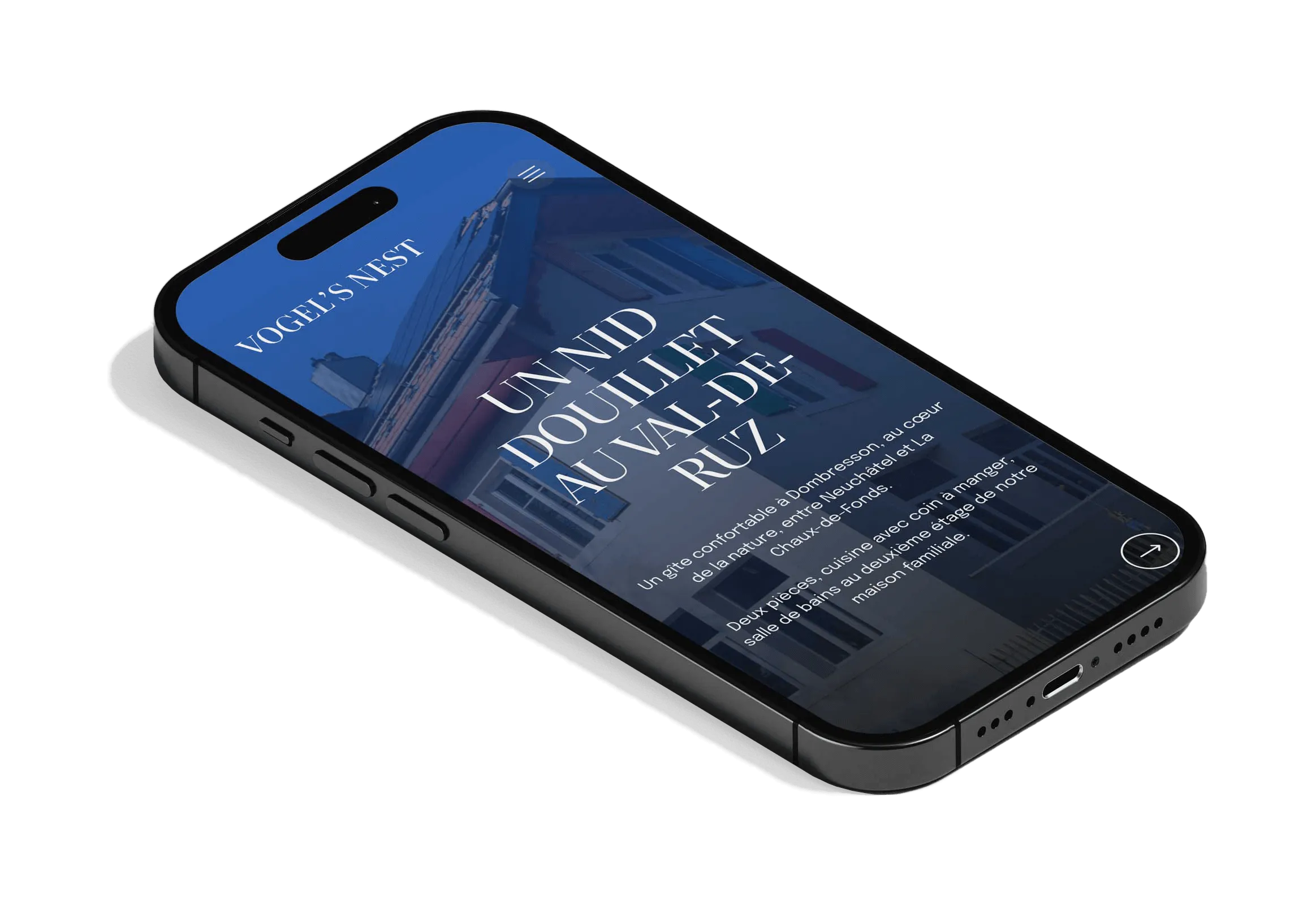 A smartphone showing on its screen a website built by TimDesign for Vogel's Nest.