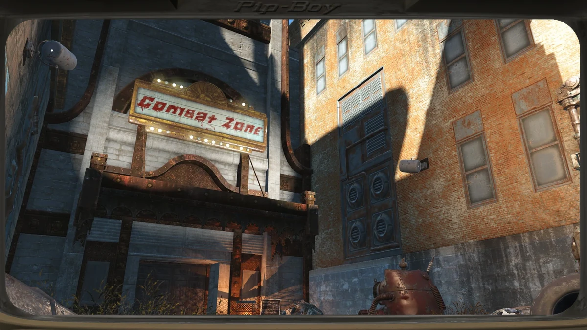 Fachada del Combat Zone en Fallout 4, el antiguo Orpheum Theatre de Boston con su rótulo iluminado y la entrada custodiada por saqueadores.