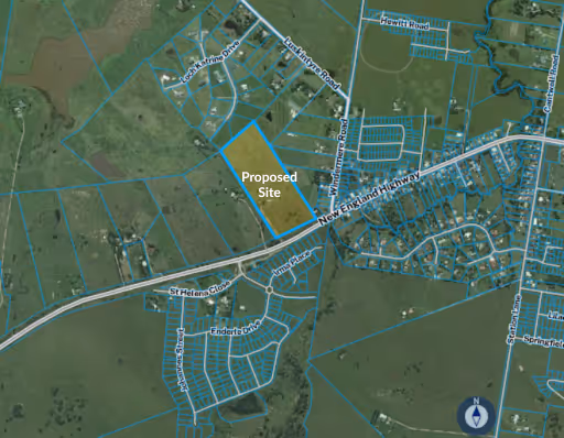 Aerial map showing a highlighted rectangular area labeled 'Proposed Site' near New England Highway and Lockhartville Road with surrounding property boundaries and roads.