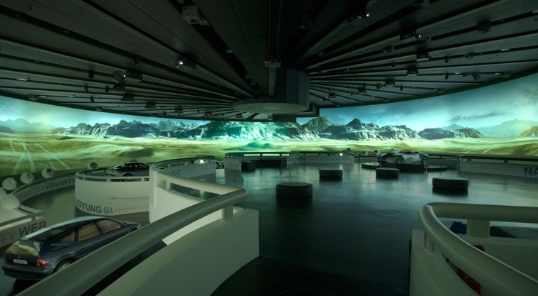 Modern museum gallery with luxury cars and mountain landscape projection on panoramic screen