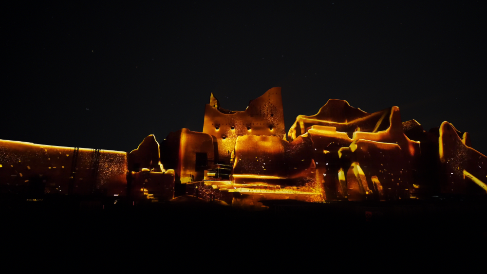 Glowing hot metal industrial machinery and equipment against dark background at night