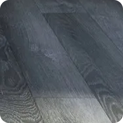 Close-up of dark gray wooden floor planks with visible wood grain texture.