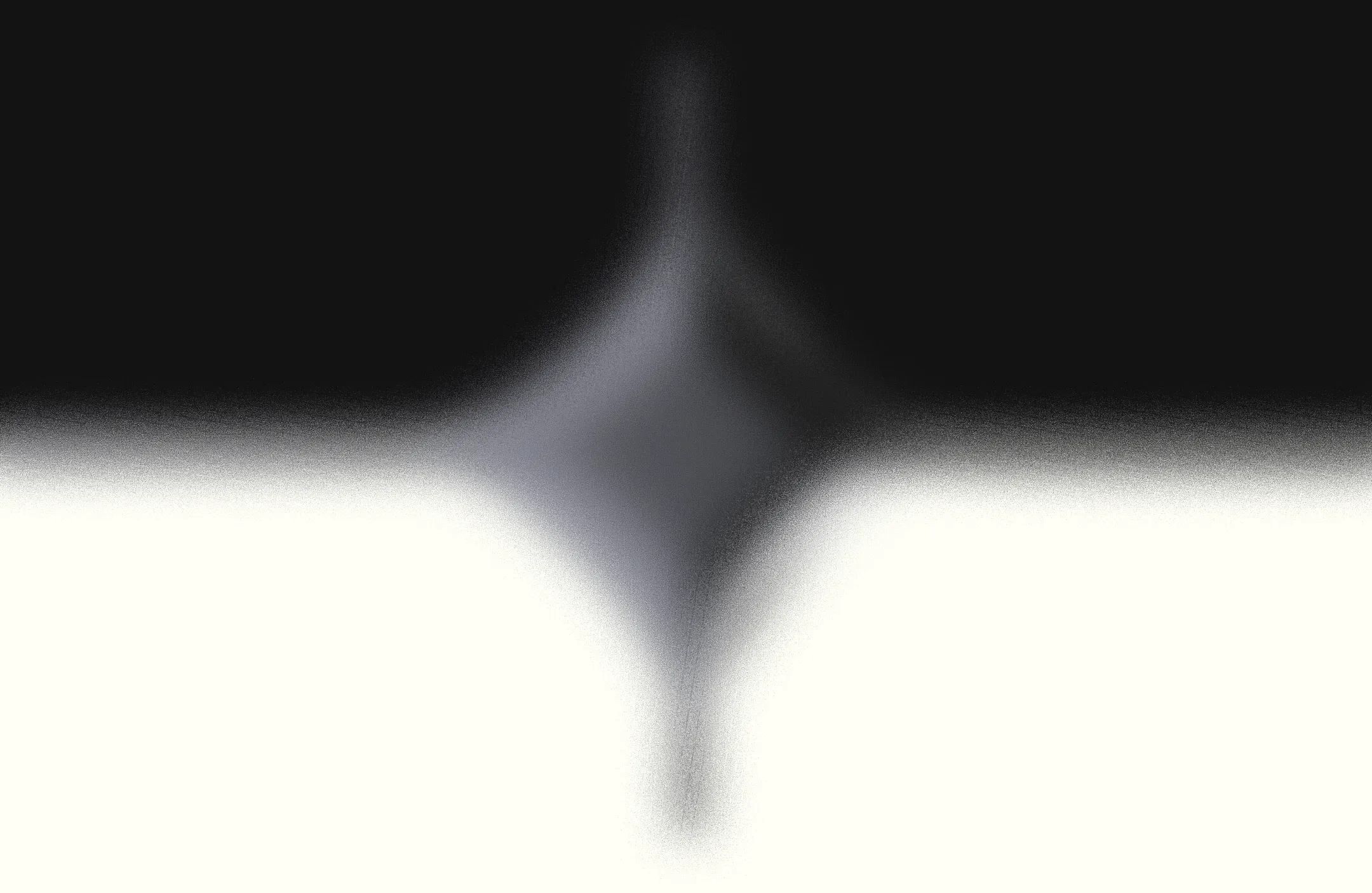 Abstract black and white symmetrical gradient forming a blurred diamond shape in the center.