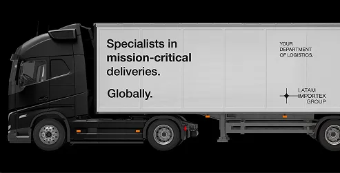 Black semi-truck with a white trailer displaying text about mission-critical deliveries by LATAM Importex Group.