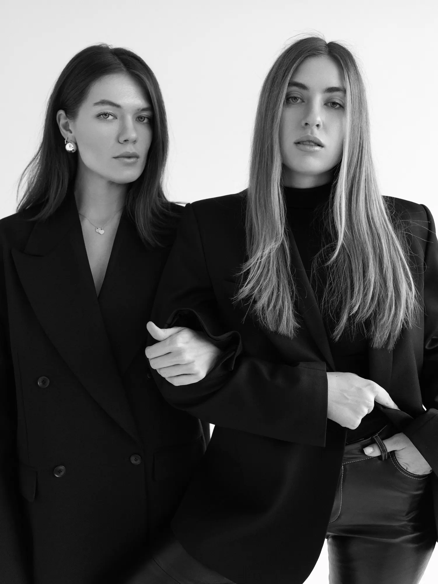 FANDS MARKETING AGENCY — Two women with long hair embracing each other warmly, both smiling with eyes closed.