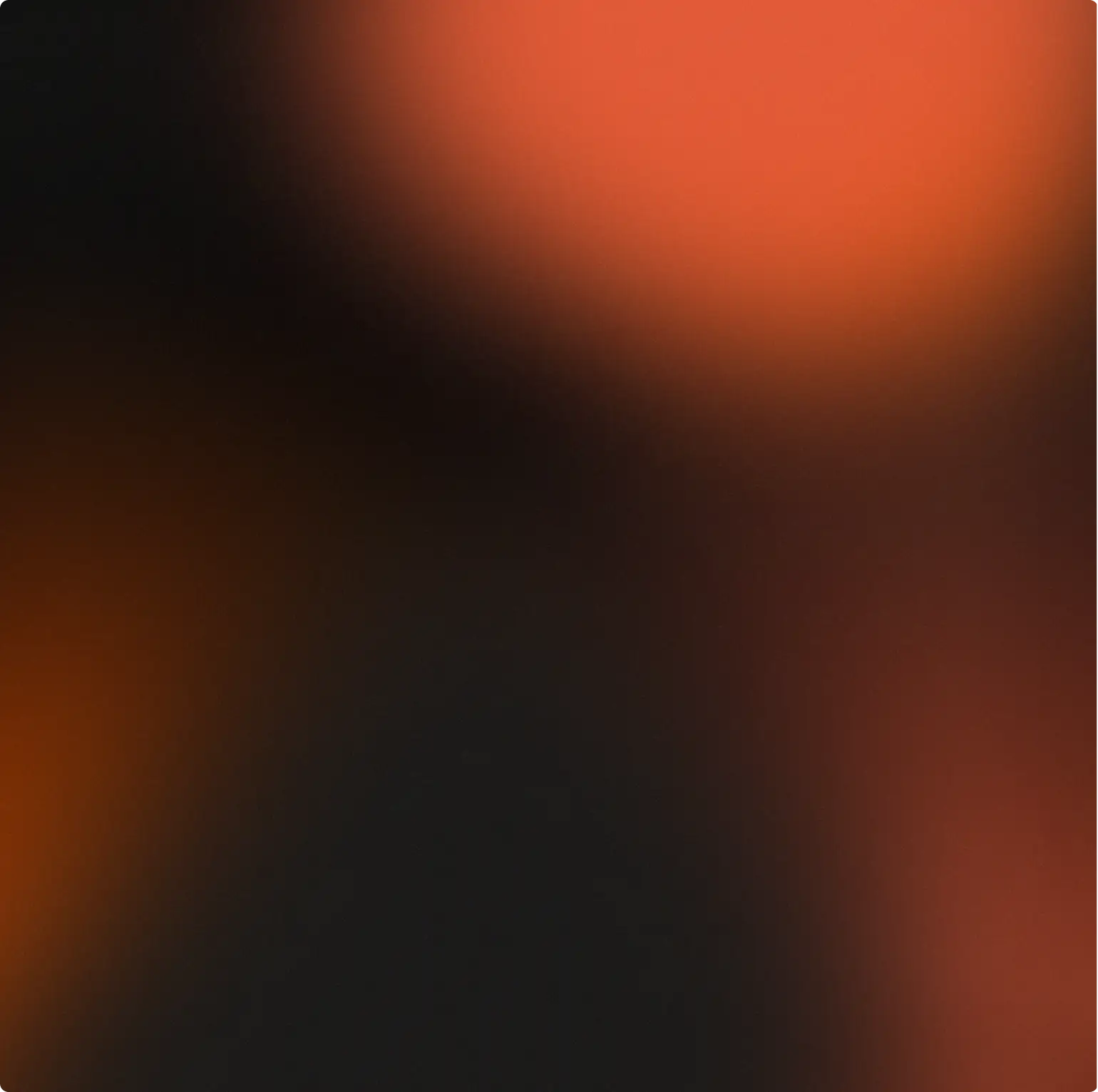 Blurred dark background with orange and red light spots creating an abstract gradient effect.