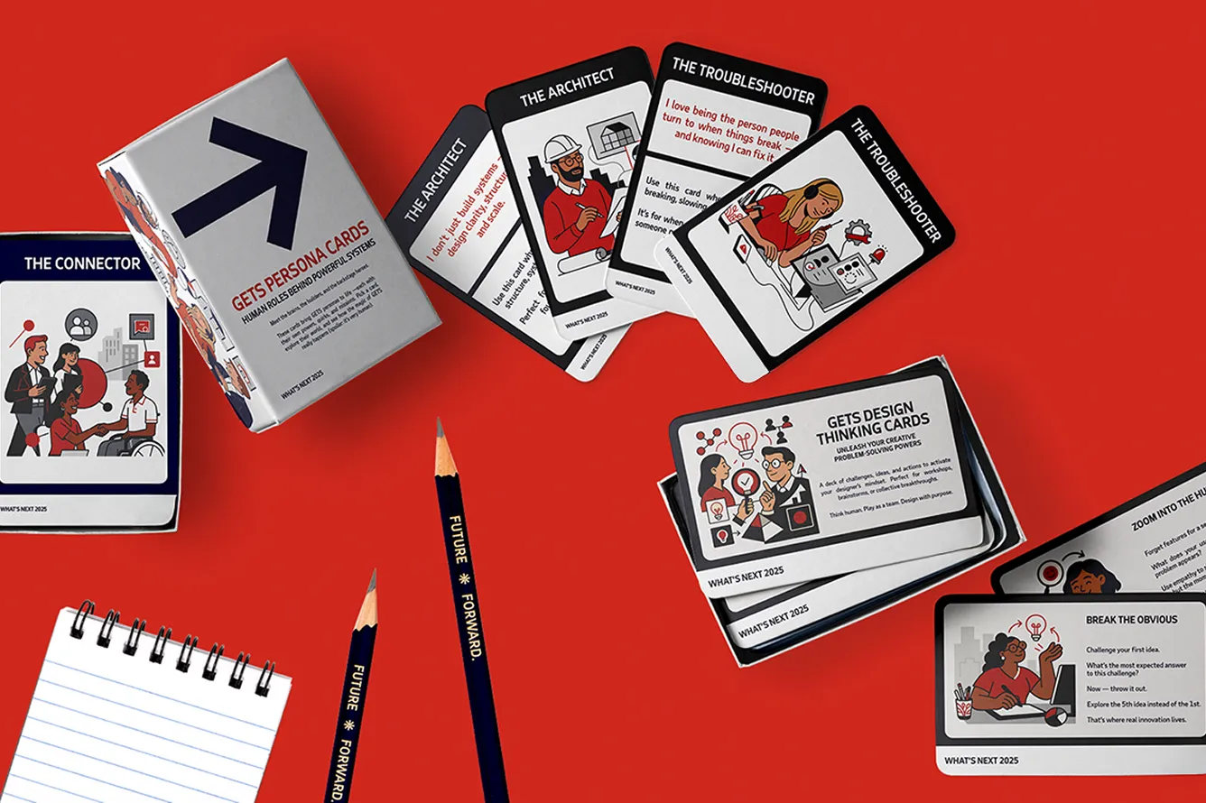 GETS Persona Cards and Design Thinking Cards spread on a red surface with two pencils labeled 'Future Forward' and a spiral notebook.