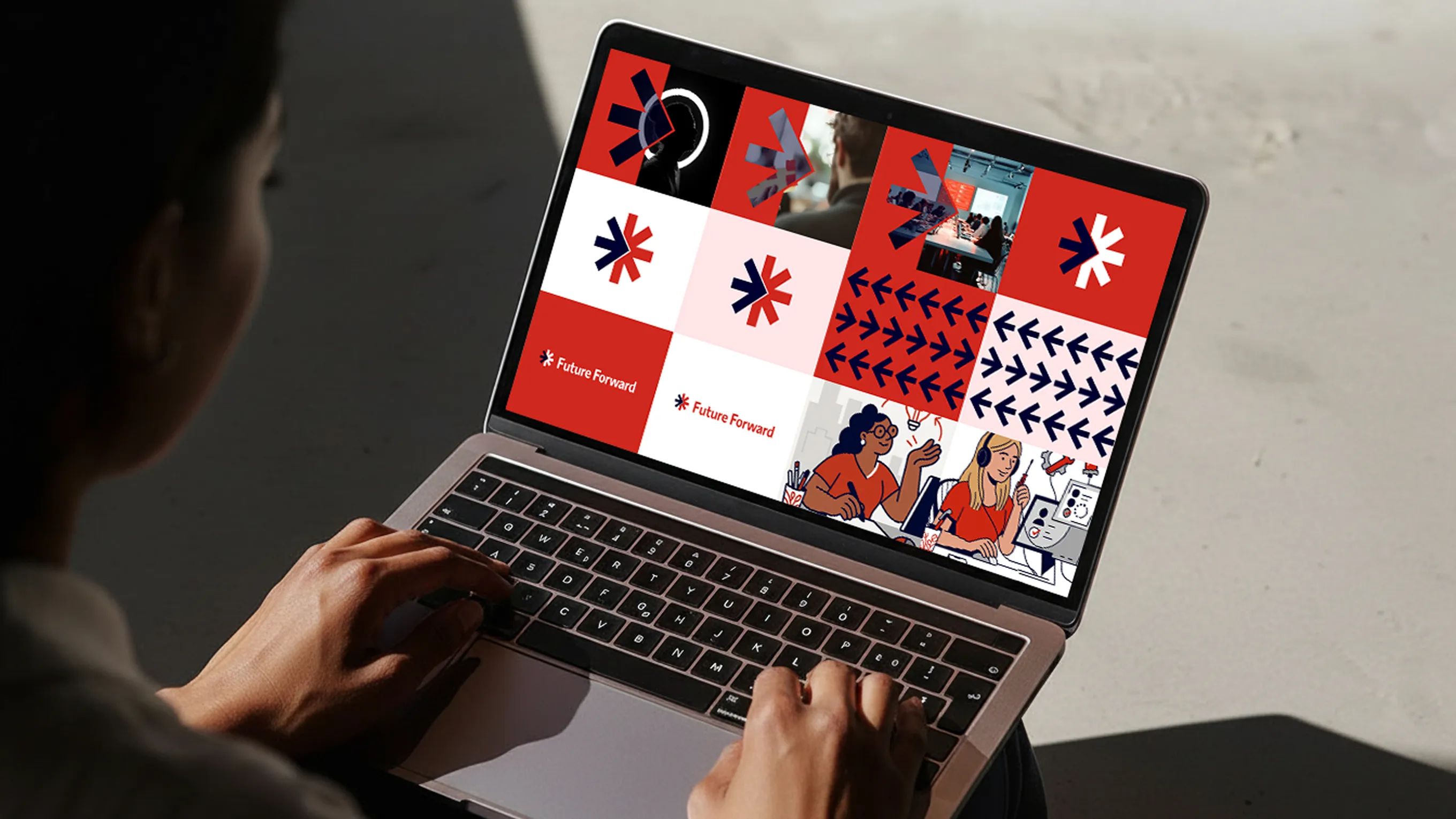 Person using a laptop displaying a graphic design with red, white, and navy blue arrows, text saying 'Future Forward', and illustrations of two women working.