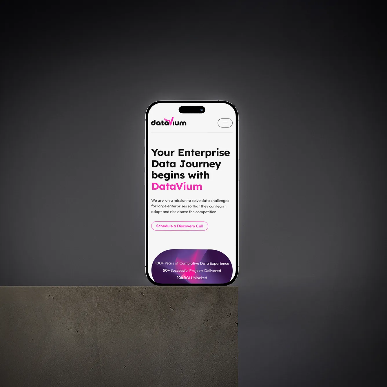 Smartphone displaying DataVium website homepage with headline about enterprise data journey and a call-to-action button.