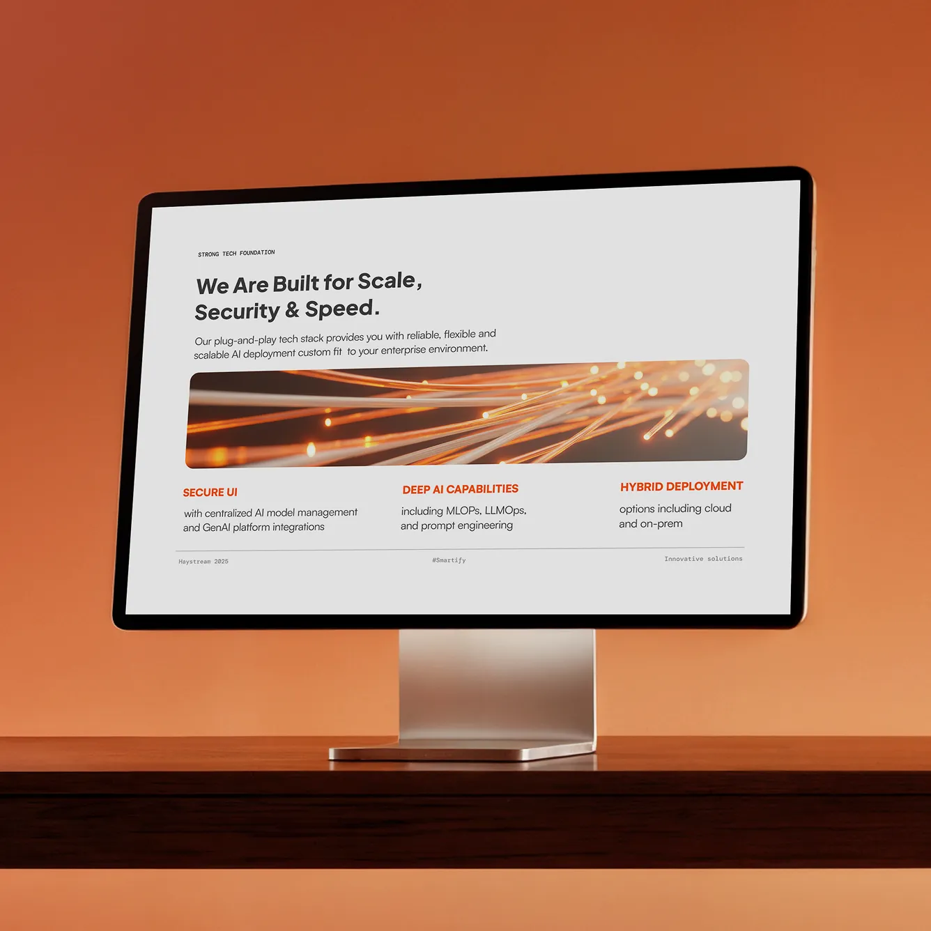 Computer screen displaying a presentation slide about scalable AI deployment emphasizing secure UI, deep AI capabilities, and hybrid deployment options.