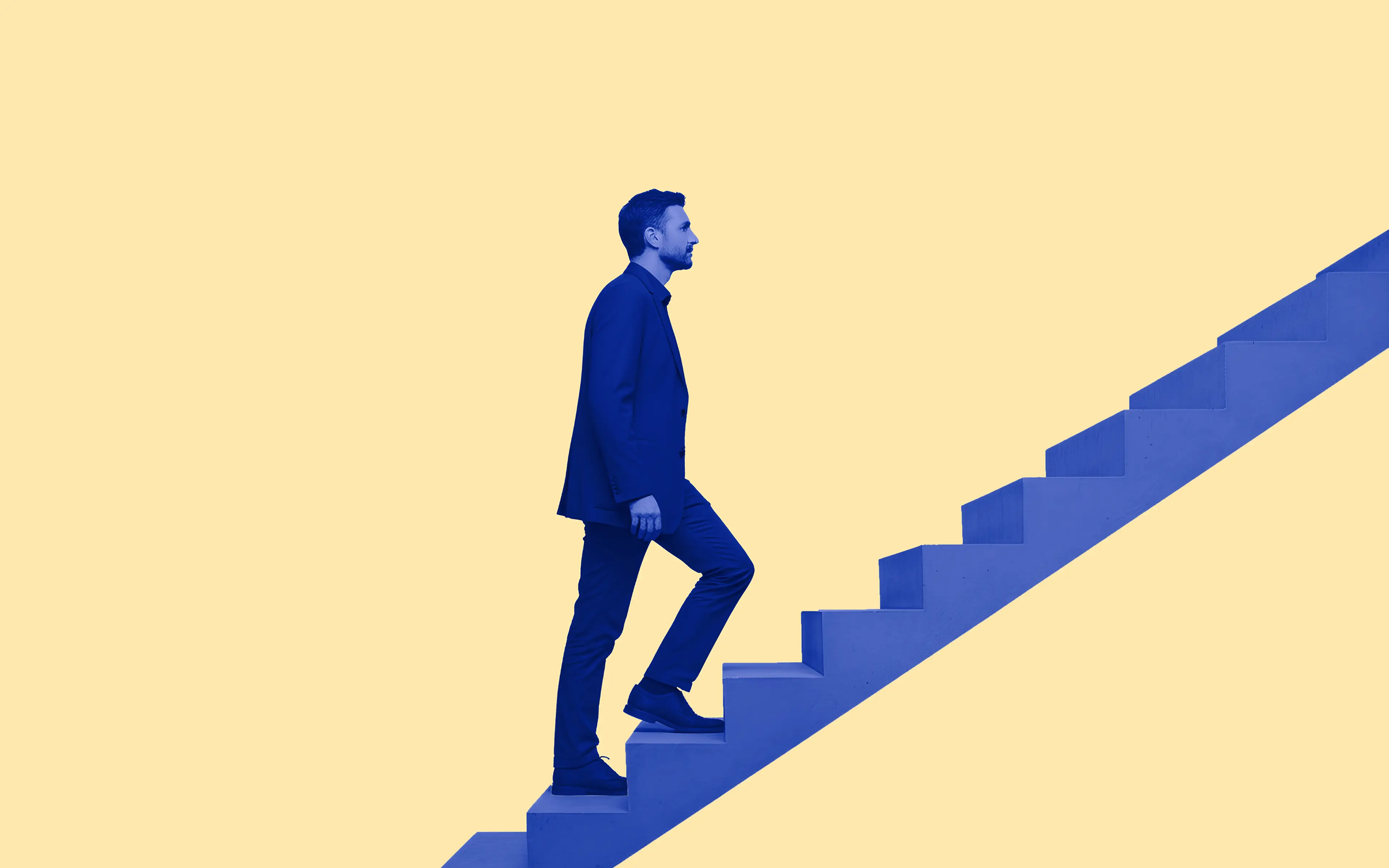 Man in a suit climbing blue stairs against a pale yellow background.