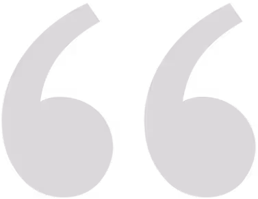 Large gray stylized opening quotation marks symbol.