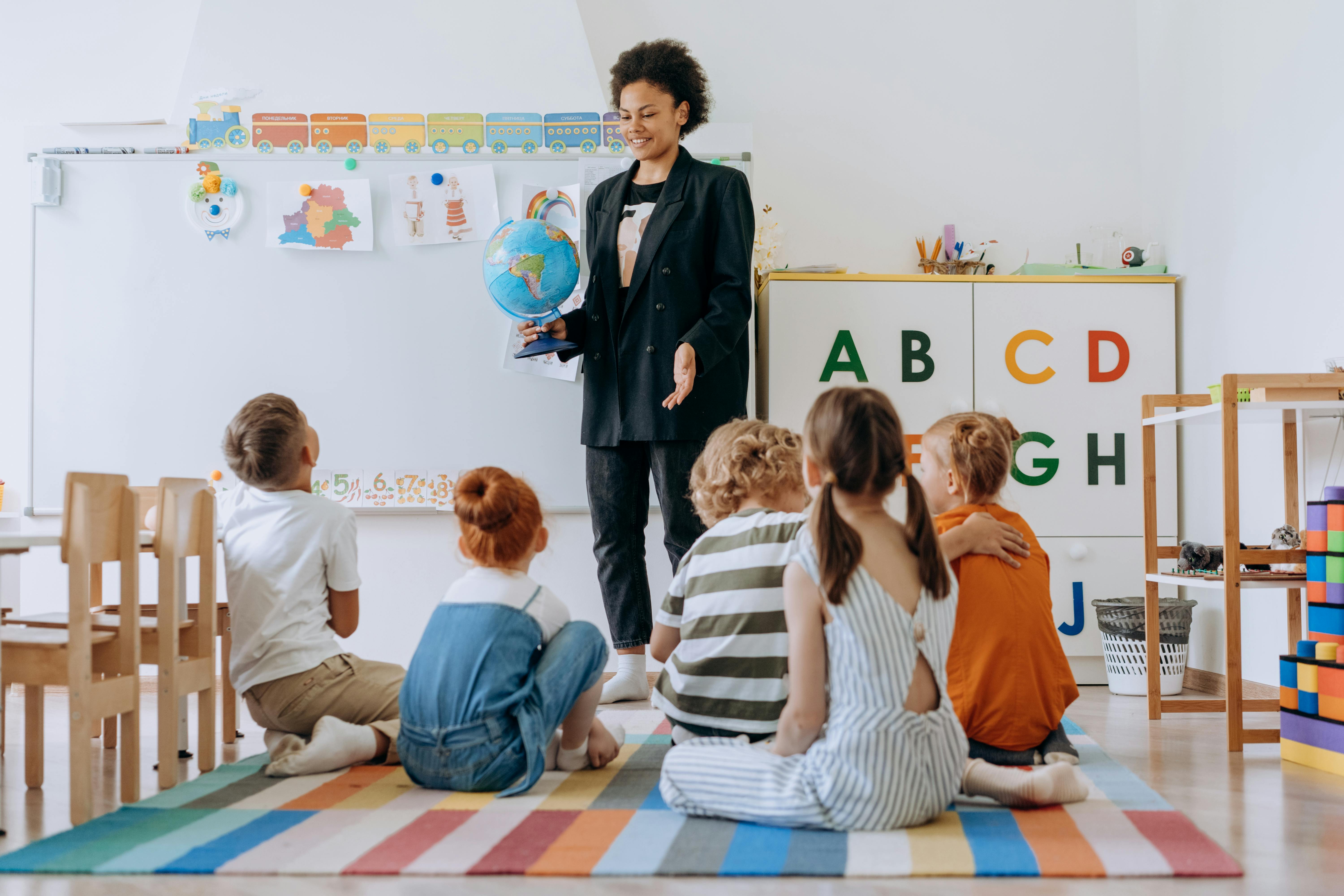 A group of children listening to their lecturer