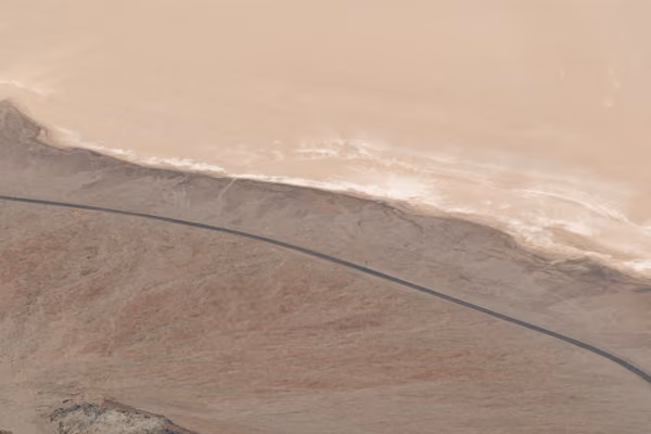 A winding road through a desert landscape