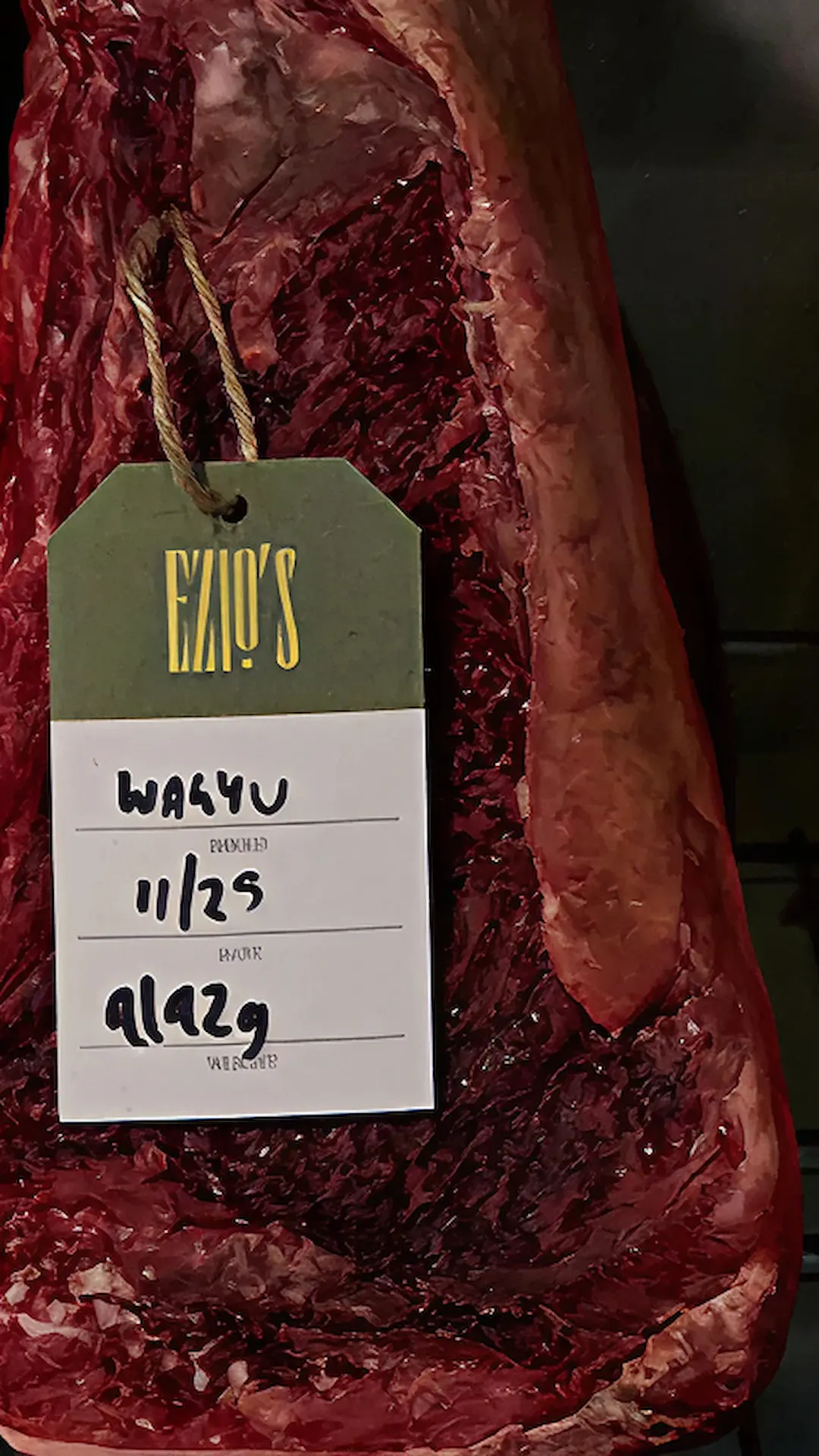 Banquet table at Ezio's Hotel featuring an assortment of dishes: crispy roasted chicken, golden fries, shrimp cocktail, fine charcuterie, and buttered brioche rolls.