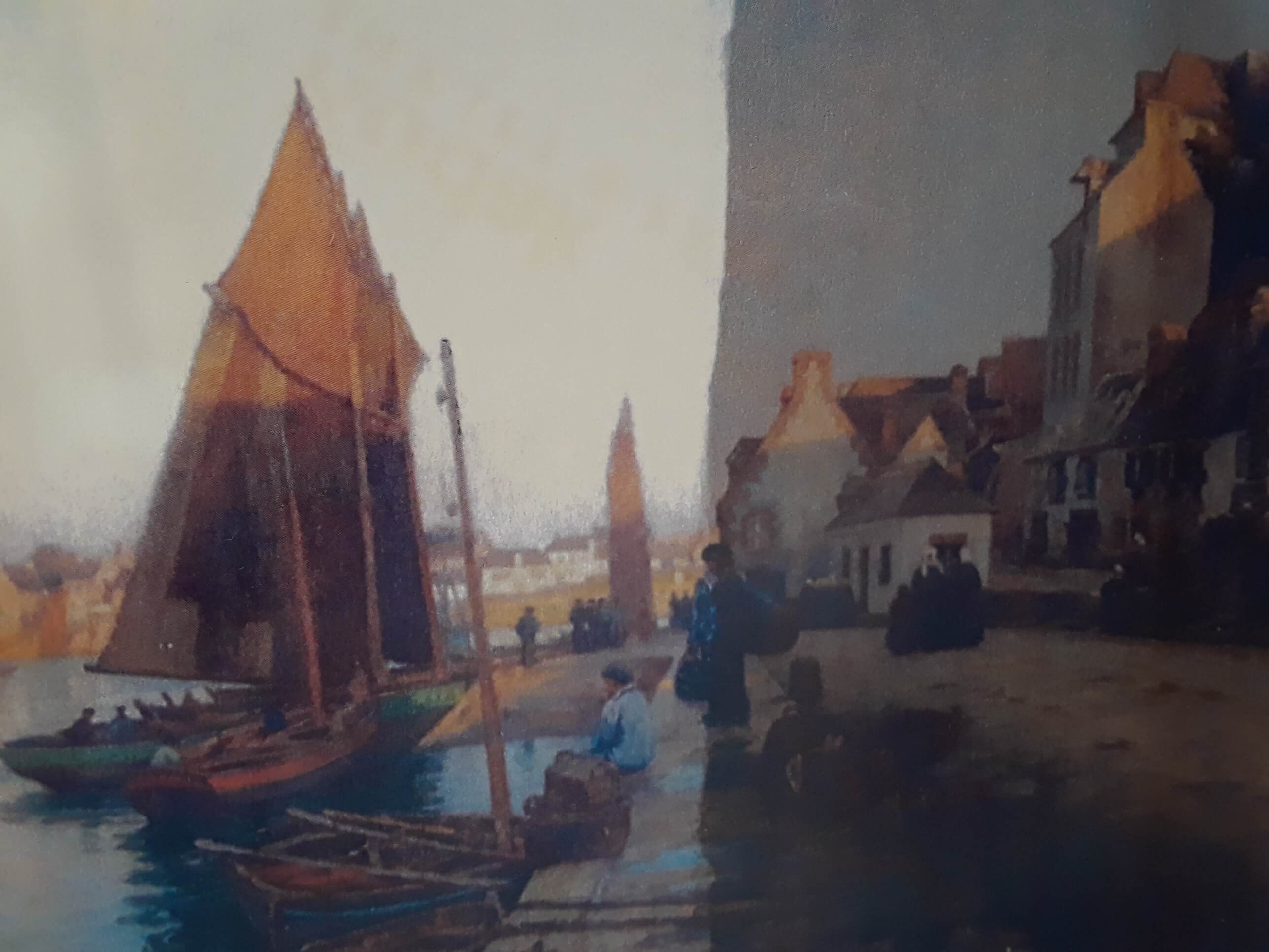 Oil painting of a harbor scene with sailboats docked near a waterfront village and people on the pier.