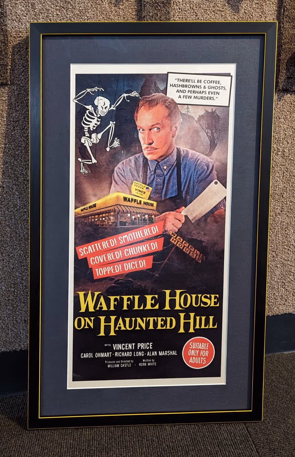 Framed movie poster titled 'Waffle House on Haunted Hill' featuring a man holding a cleaver, a skeleton marionette, and a Waffle House diner, with phrases about food styles and a ghostly theme.