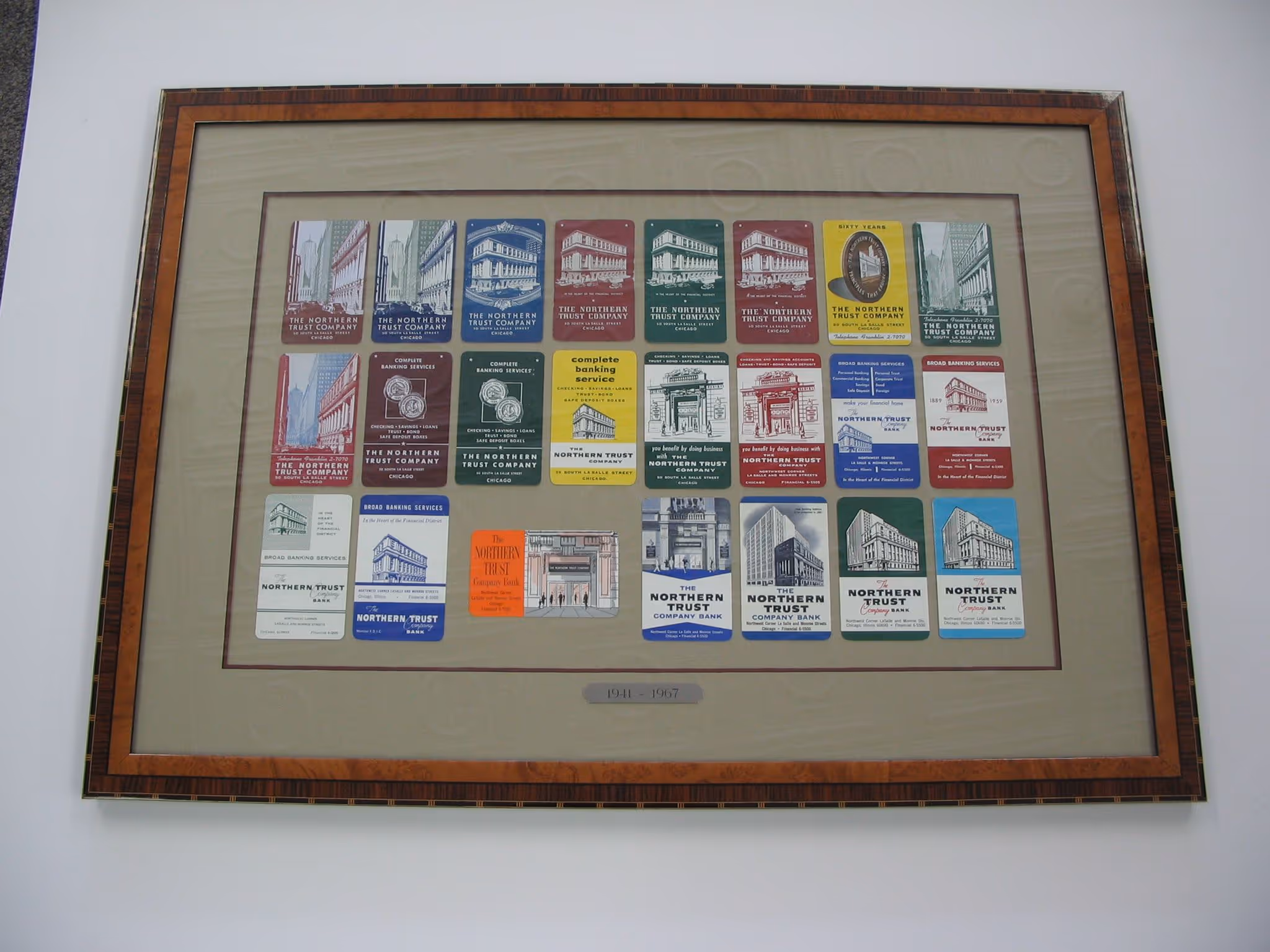 Framed collection of vintage Northern Trust Company and Northern Trust Bank tickets and cards from 1941 to 1967.