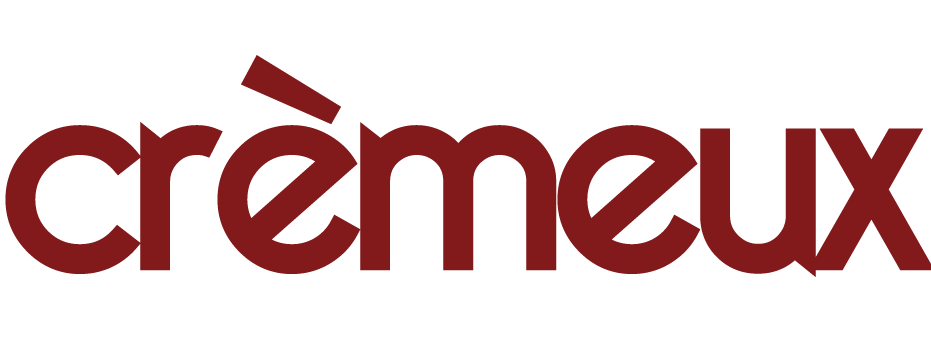 The word 'crèmeux' written in lowercase letters with a distinctive red-brown color.