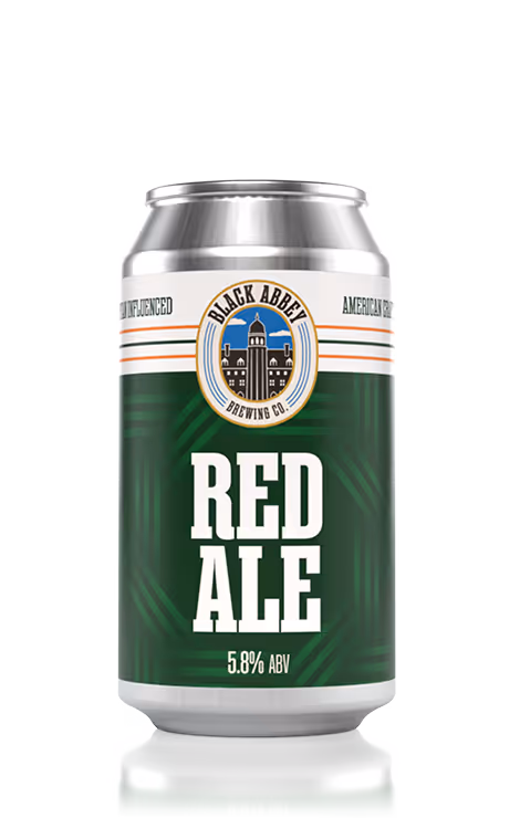 Can of Black Abbey Brewing Co. Red Ale with 5.8% ABV on a green label.