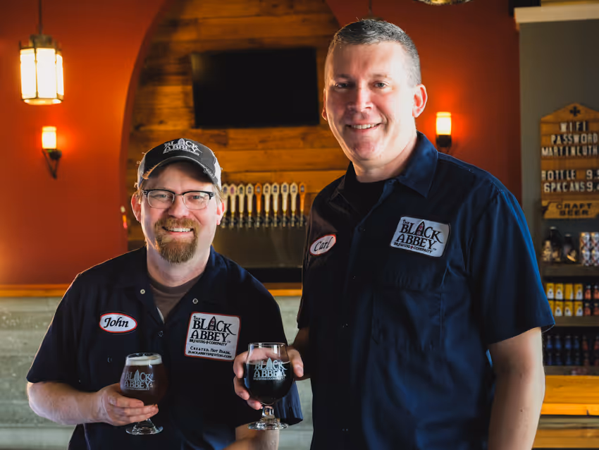 Image of owners John Owen (left) and Carl Meier (right) standing in the taproom.