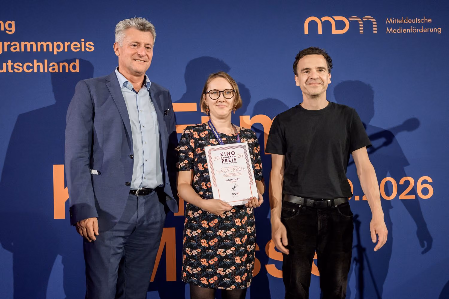 Drei Personen mit Hauptpreis der MDM