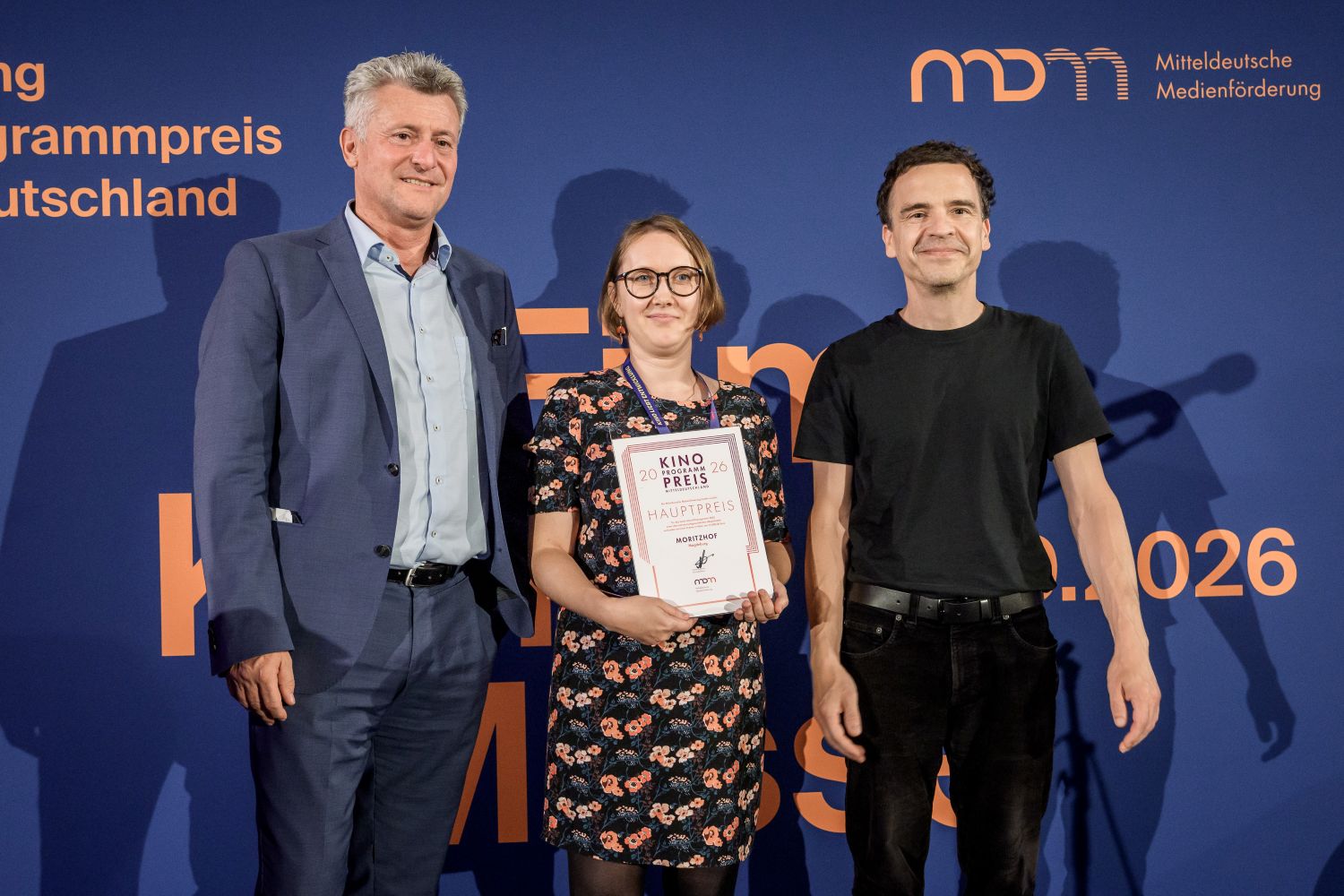 Drei Personen mit Hauptpreis der MDM