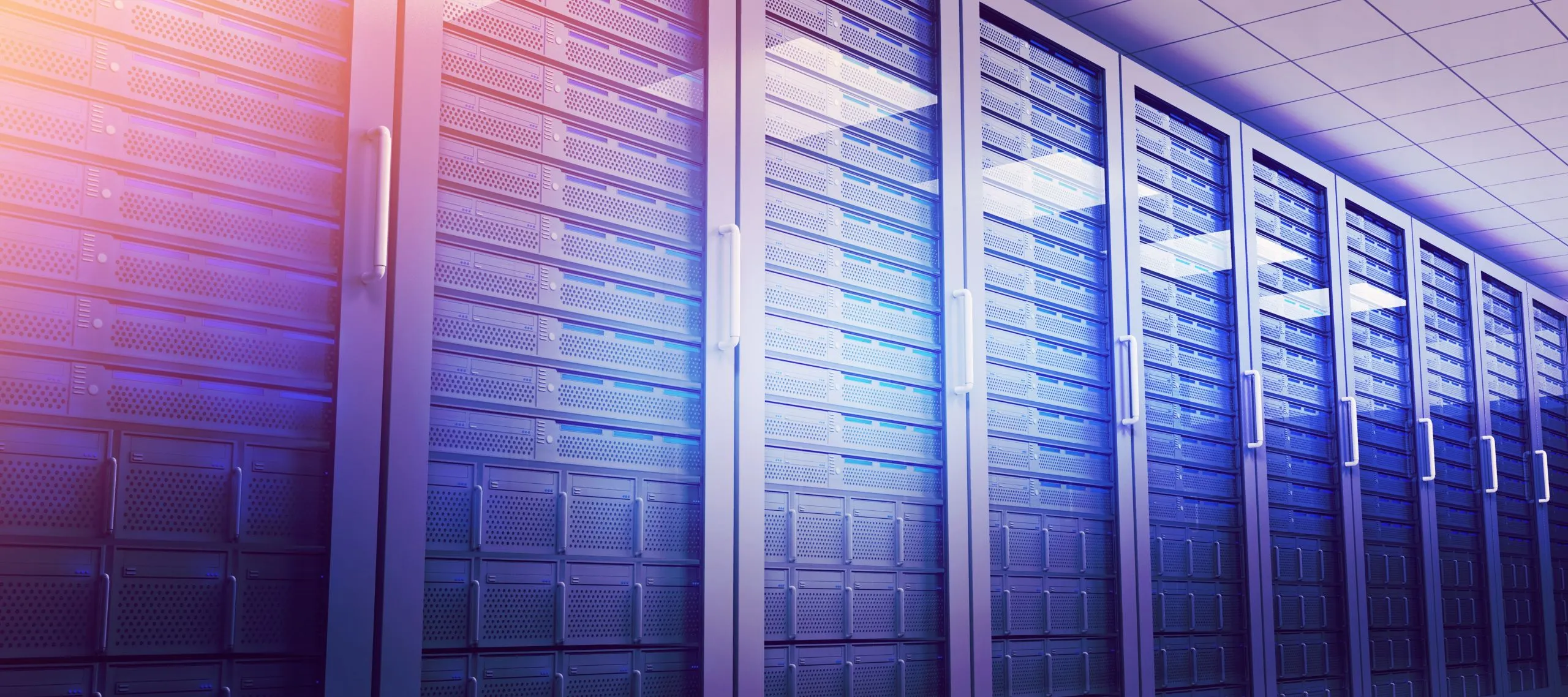 Row of server racks with cooling vents and handles in a data center with blue lighting.