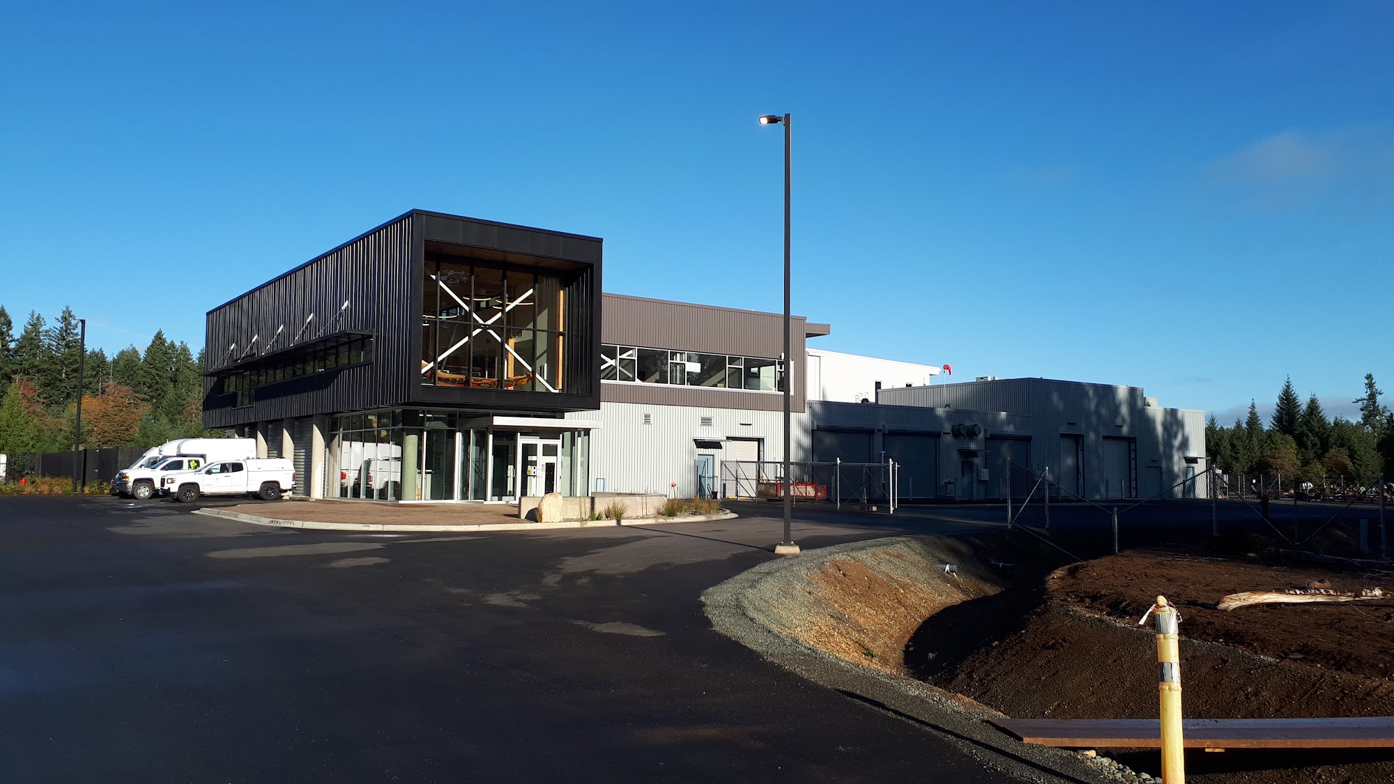 Commercial roof with HVAC equipment curbs and penetrations integrated during construction on a Vancouver Island project.