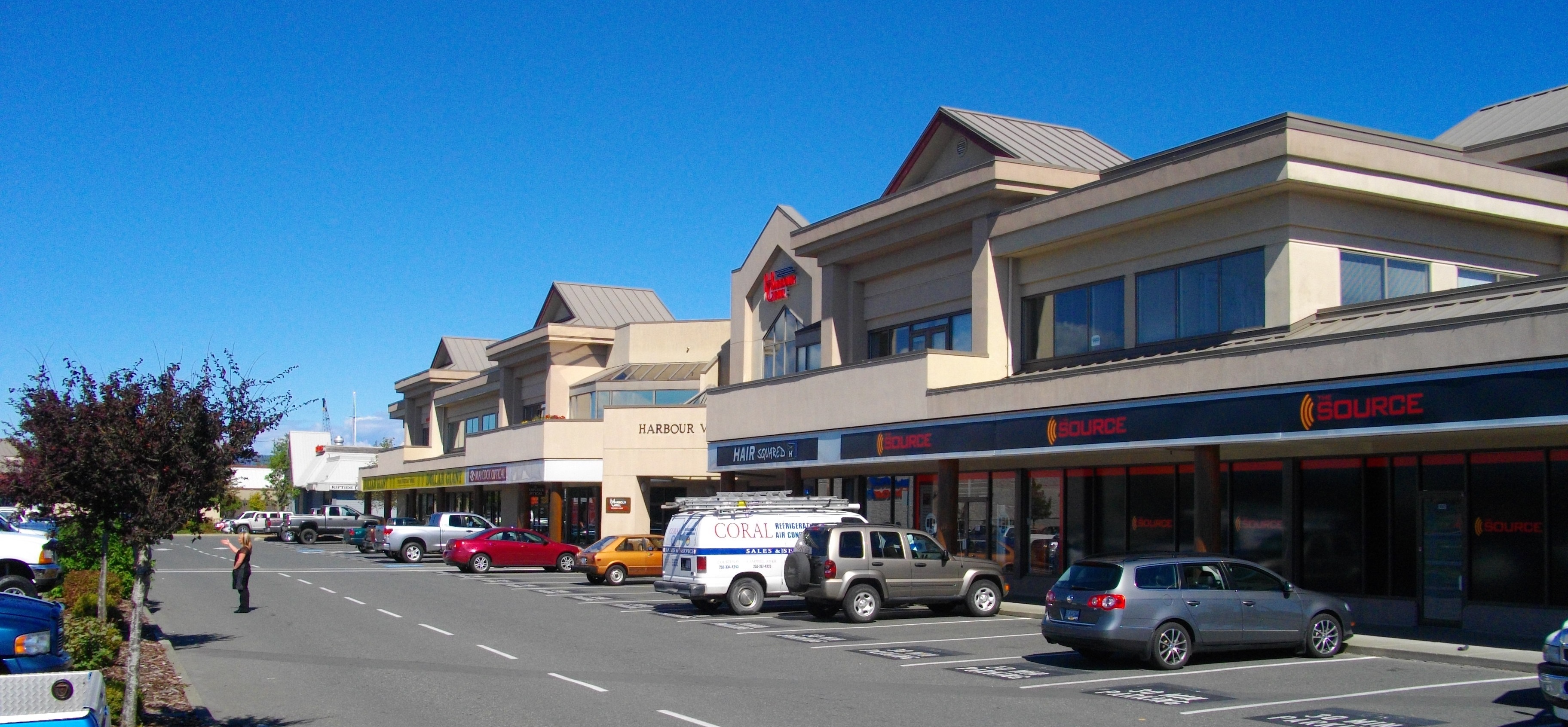 Discovery Harbour Shopping Centre storefront in Campbell River showing commercial tenants and parking area