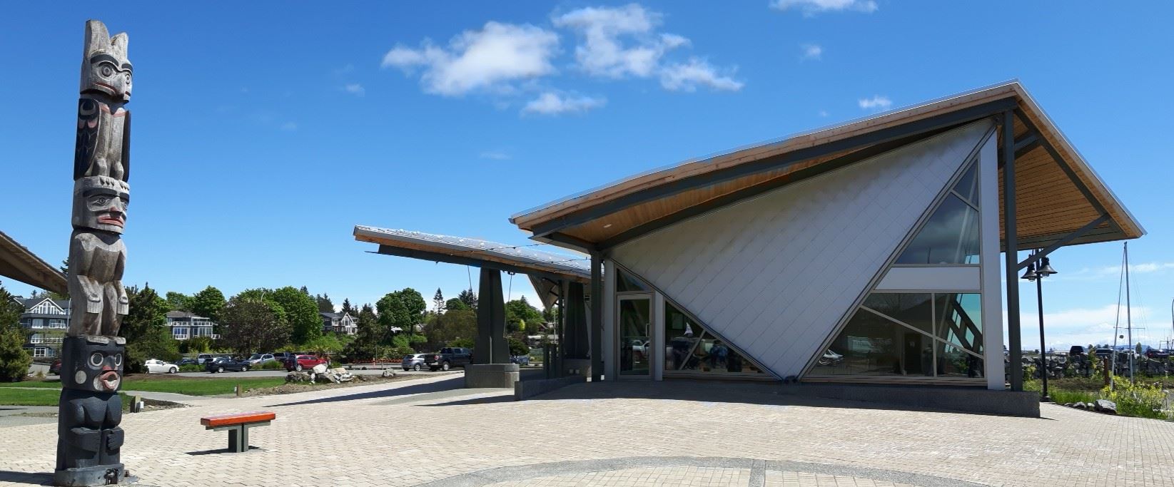 Standing seam metal roofing installed on the Comox Marina Park waterfront pavilion, with vertical seams running the full panel length