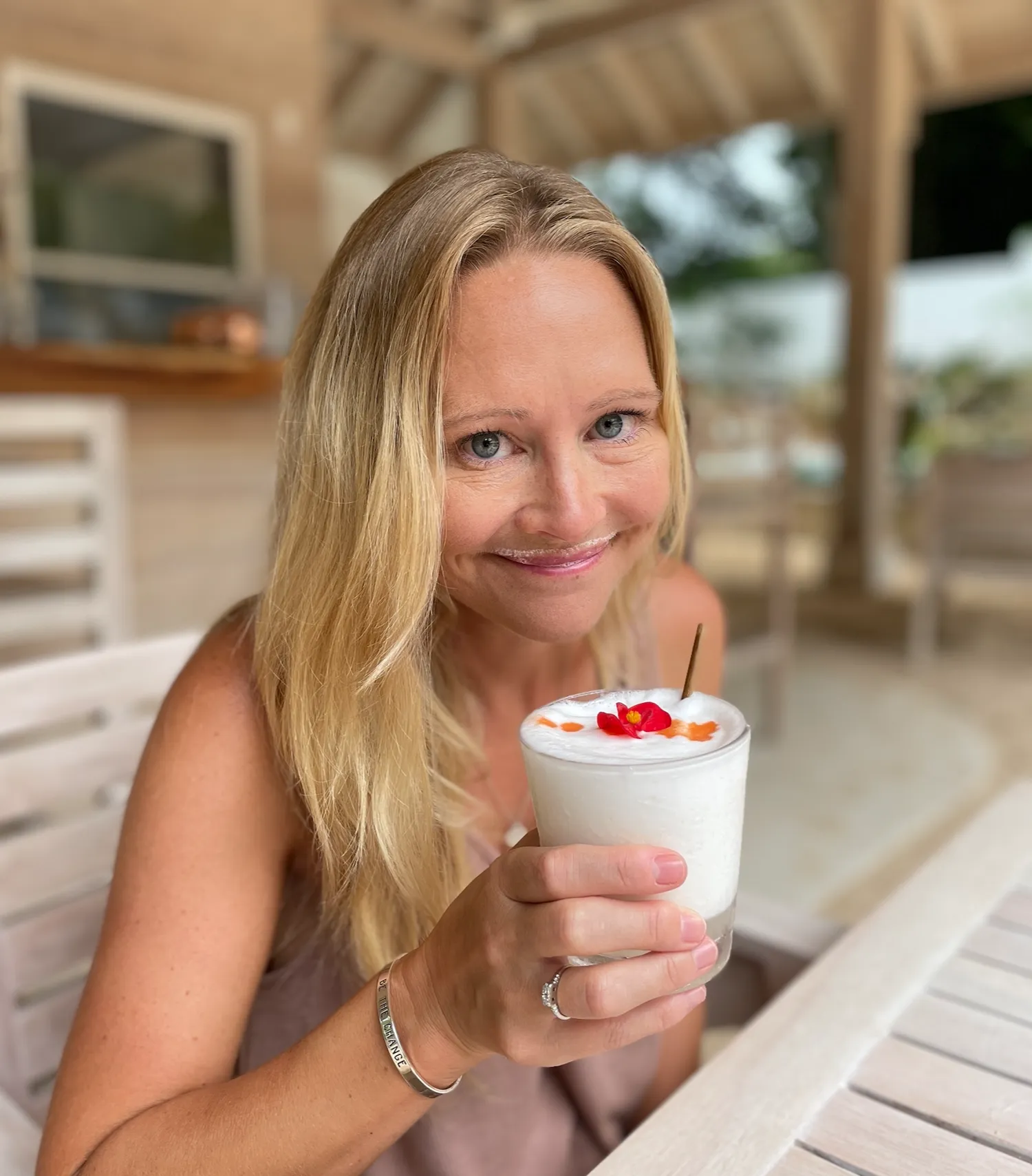 Erin Lockwood drinks a cocktail