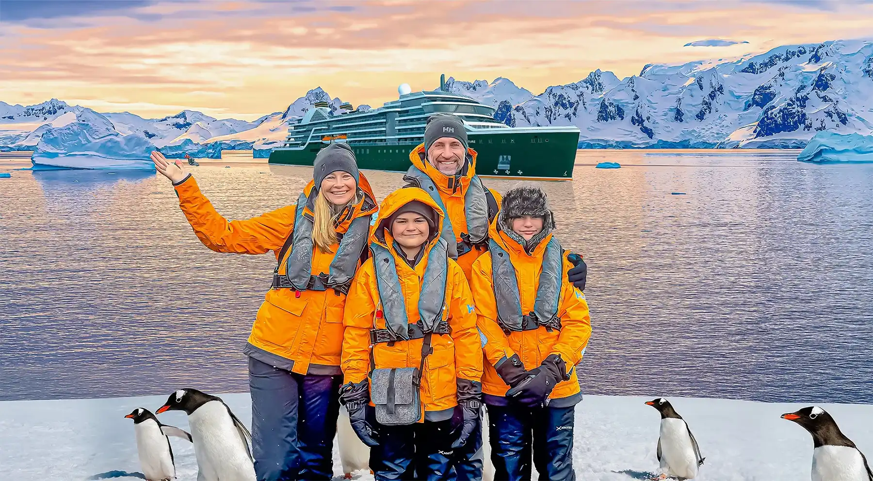 The Lockwood family stands on Antarctica with penguins all around and the Seabourn Venture in the background